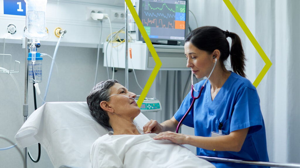 Critical Care Physician using a Stethoscope on a patient.