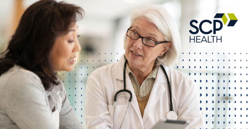 Medical professional discussing information with a patient.